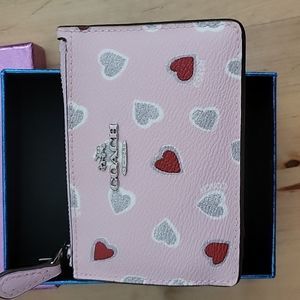 Adorable pink heart print Coach ID wallet.